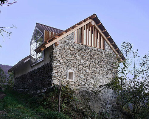 officina82 employs wood and stone to renovate abandoned rye barn in the italian alps