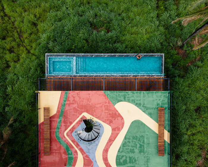 fb+mp arquitetos applies colorful tiling to tune house's elongated swimming pool in brazil