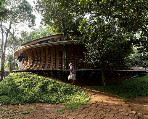 wallmakers weaves recycled plastic toys into the earthen facade of this home in india