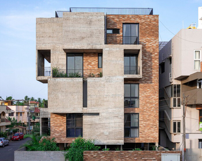 concrete and brick interplay on multi-layered residence's geometric facade by rahul pudale