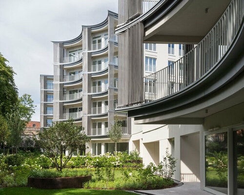 scalloped facade shapes poland's perfumiarnia apartments by JEMS architekci