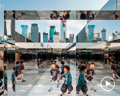 mirror maze's reflective pathways distort hong kong's harborfront