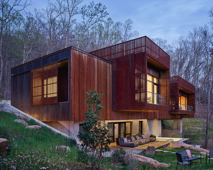 HEDS architects' wraps residence in the woods in corten steel corrugated to an owl's hoots