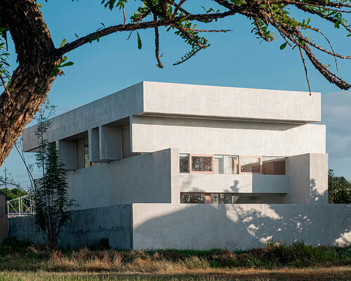 light and air permeate through residence's stacked concrete volumes in philippines