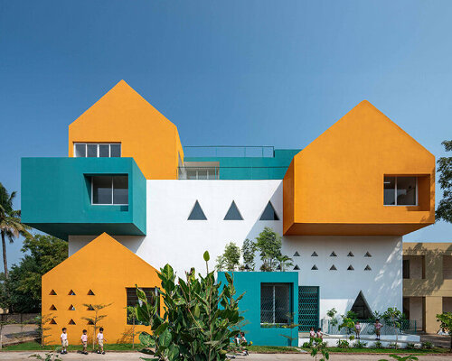 projected cantilevers and recessed windows in vibrant hues shape school in india