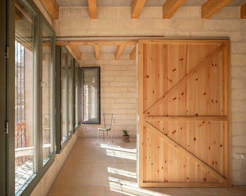 thick marés sandstone walls compose 19 social housing, salvador espriu by IBAVI in palma