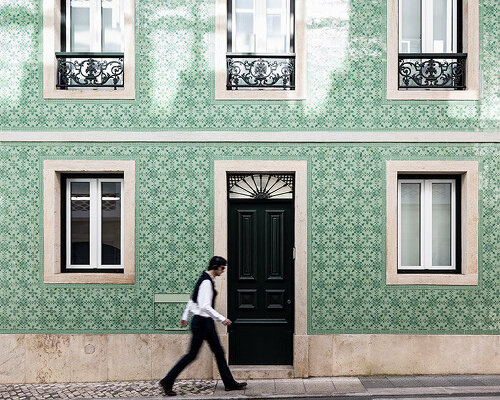 camarim arquitetos restores lisbon house with decorative facade of patterned tiles