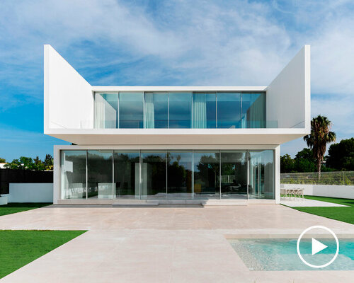 ruben muedra arquitectura's wisdom house stacks two white glazed prisms in valencia