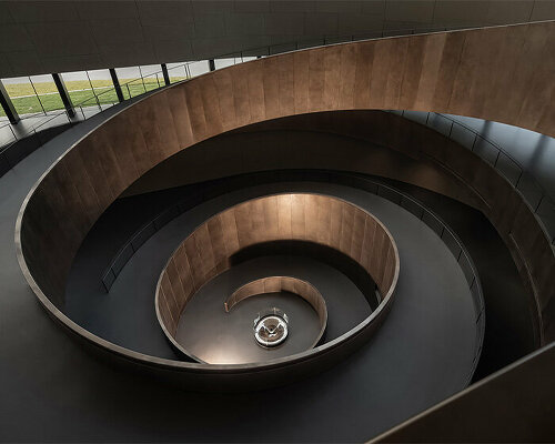 csd.design's interior layout for sanxingdui museum in china forms around copper spiral ramp