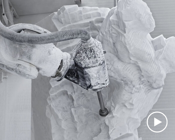 robot arm and its unfinished marble sculpture play the lead in quayola’s film for max cooper