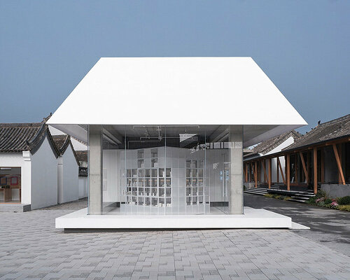 translucent pitched roof tops glass-clad store by designRESERVE in chinese village