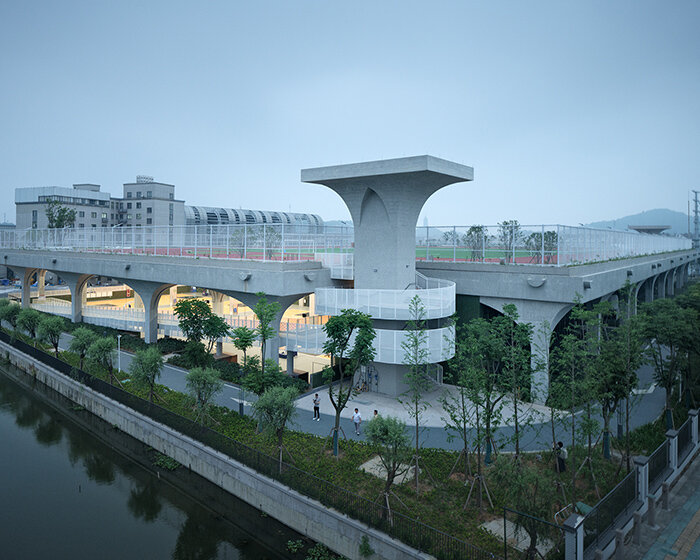 arched structural canopy outlines indoor sports field at shaoxing university in china by UAD