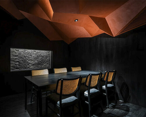 vermilion origami ceiling unfolds inside inrestudio's sushi restaurant in vietnam 