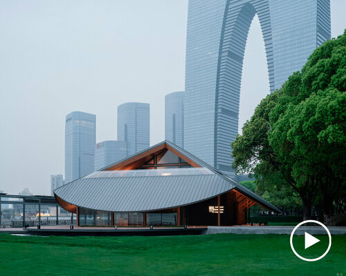 large pitched roof with curved eaves shields galaxy arch's jinji lake pavilion in china