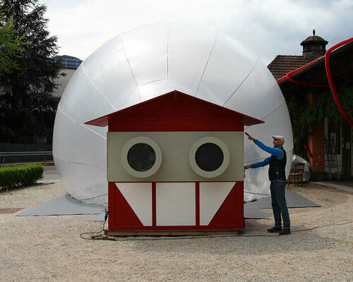 inflatable installation by moradavaga lands in the former train station aur-ora in italy