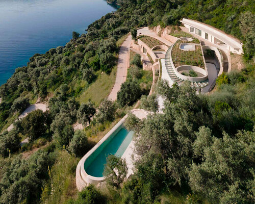 thyta house's curvilinear silhouettes run along the mountainous landscape of lefkada, greece