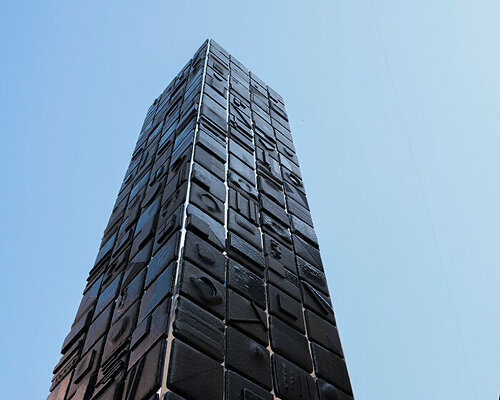 repurposed lava stones set up nerosicilia re-design tower installation for milan design week