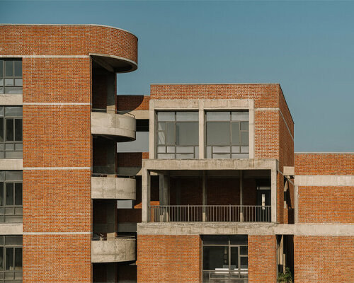 rigid and curved brick volumes collide at girl’s nursing college & hostel in india