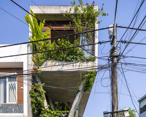 'nest house' floats in vietnam with breezy, minimalist design by architect ho khue