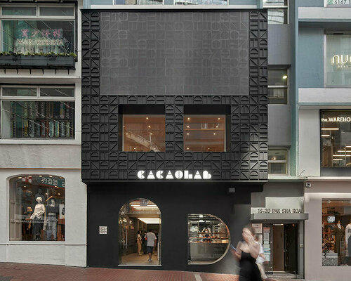 other projects' monogram facade conceals new-age cacaolab flagship store in hong kong