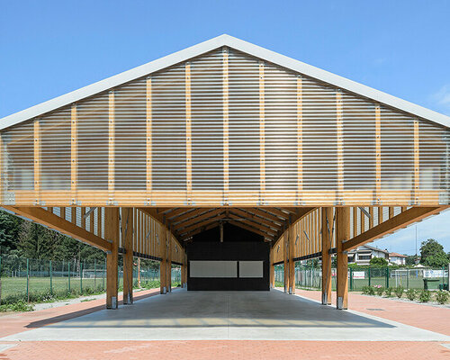 veil of wooden slats overhangs above paolo citterio architects' terravolante pavilion in italy