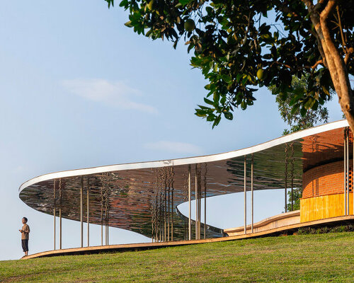 idee architects' quin pavilion hovers above vietnamese forest like a steel cloud