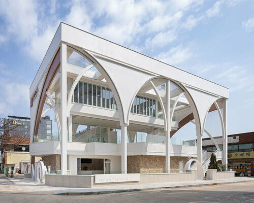 external arched metal skin forms around arcline architects' moon terrace in south korea