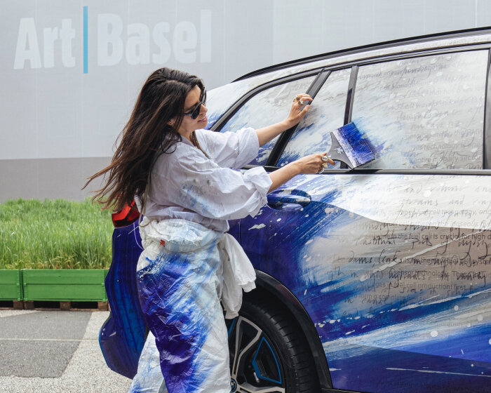 es devlin wraps pilot fleet of BMW iX5 hydrogen in blue and white collage at art basel