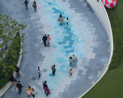 ocean wave-like paving by zaha hadid architects sweeps over chinese plaza renovation