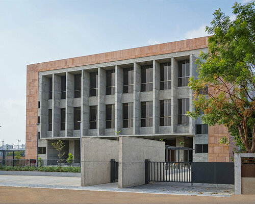 exposed concrete and pink sandstone shapes ini design studio's dahegam town hall in india