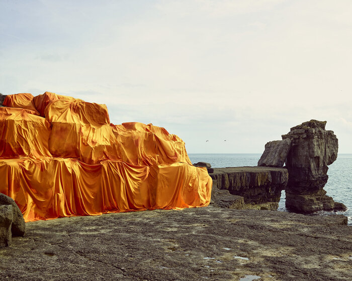 vibrant fabrics drape over chalk cliffs highlighting rock erosion of coastal landscapes