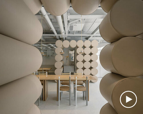 padded cylinders in soft nude colors flood noodle restaurant's interiors by office aio