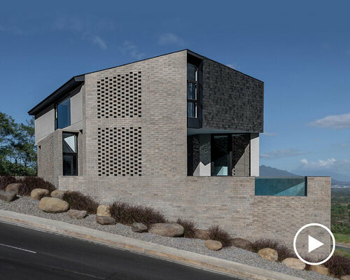 perforated adobe wall absorbs tropical heat to protect filipino residence