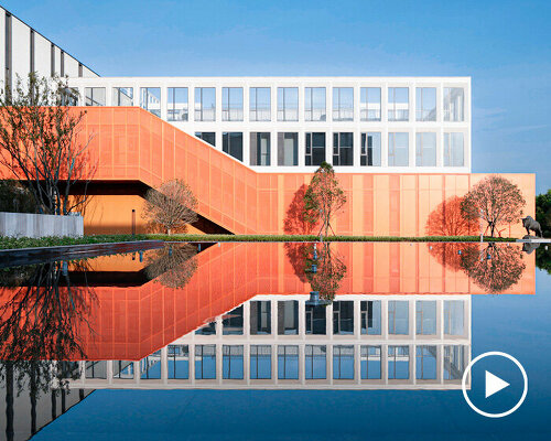 bright orange exterior corridor wraps around GLA design's office building in china