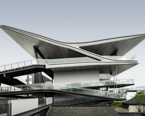 cascading planes and platforms encircle spActrum’s stellar isle center in chinese old town