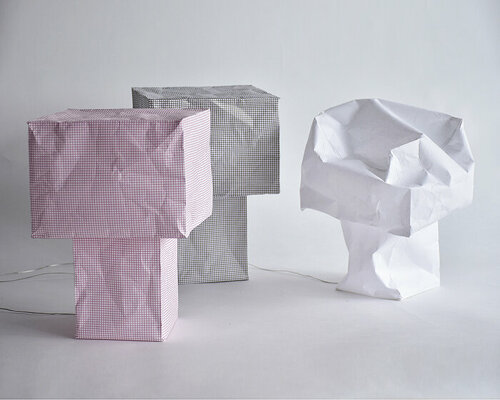 vacuum-sealed flat pack blooms into tsubomi paper lamp by kazuhiro yamanaka