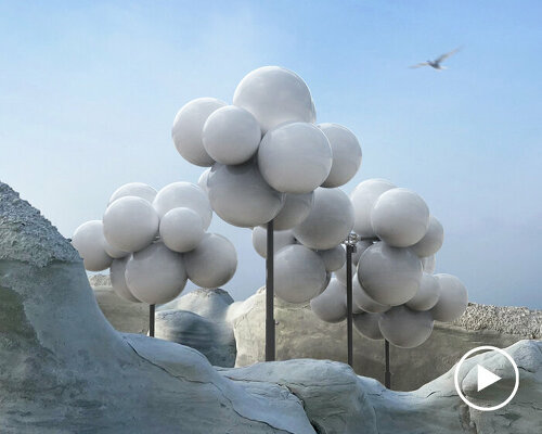 all-white molecular cloud by vincent leroy floats above the lunar landscape of milos