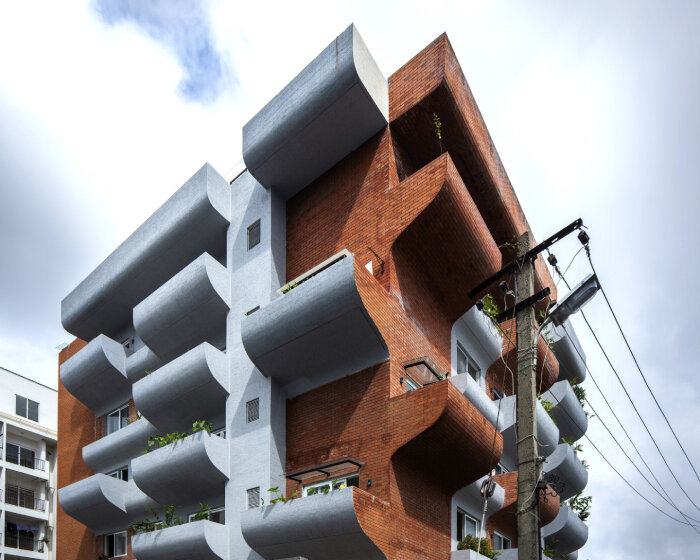 curving balconies double as environmental filters at housing complex in bangalore