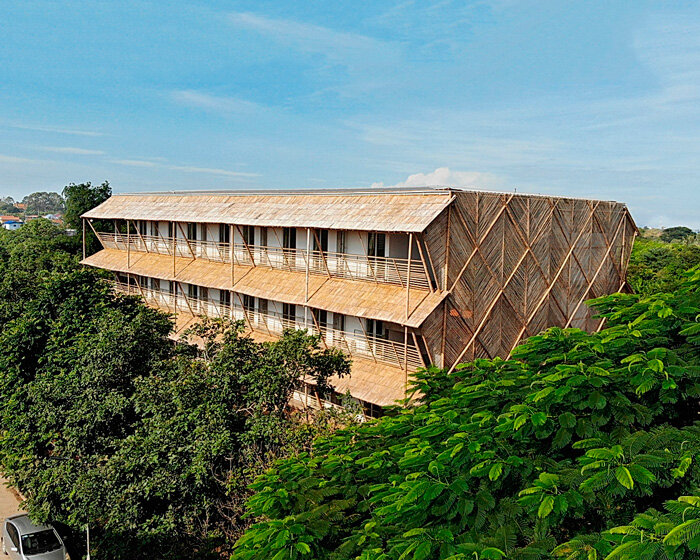 BLOOM screens girl dormitory's concrete skeleton with woven bamboo skin in cambodia