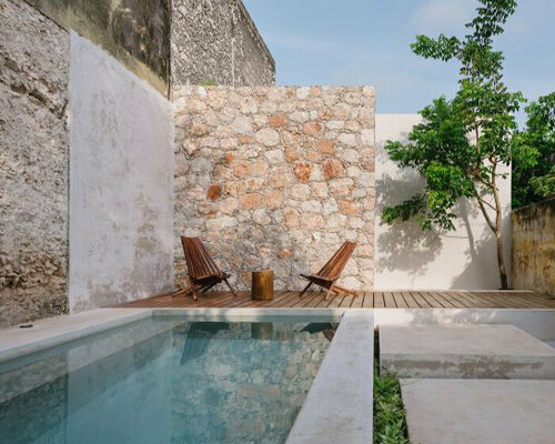 taller mexicano de arquitectura preserves casa deco's original textured stone walls in mérida