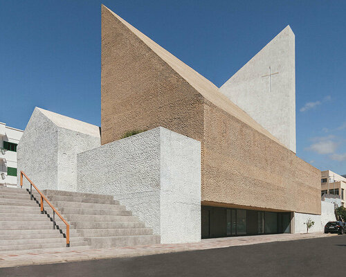 beautell arquitectos' tenerife church is a pair of cyclopean concrete volumes