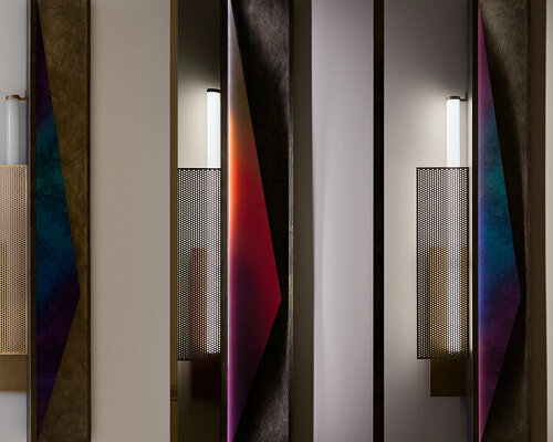 colorful mirrored wall lamp by tarek dada casts transformative reflections