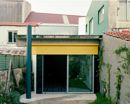 behind a modest front, fala atelier's narrow porto house reveals surprising depth and curves