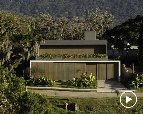 wooden sliding screens frame brazilian sunrise in family residence by studio bloco