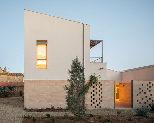 set in spain, nordest arquitectura's passive houses 1922 combine adobe, earth, and wood