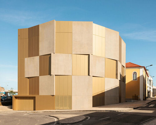 concrete panels dynamically overlap across didier faustino's housing complex in portugal