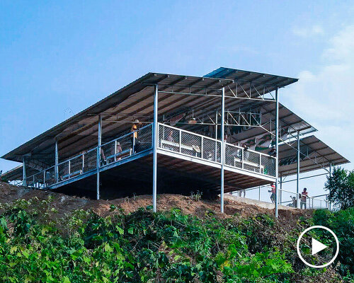 dynamic flying roof planes by PAO float over sports arenas in rural yunnan