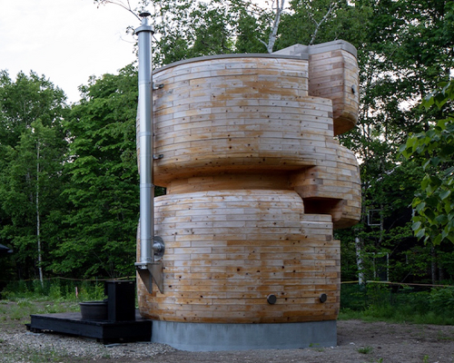 VUILD stacks curving prefabricated wood blocks to shape tower sauna in hokkaido