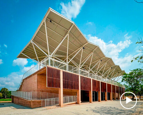 hyperbolic paraboloid metal shell rests atop revamped sports center in mexico by aidia studio