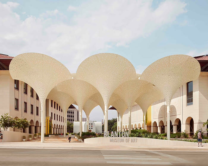 snøhetta's revised landscaping encircles arched petal canopy in austin's blanton museum